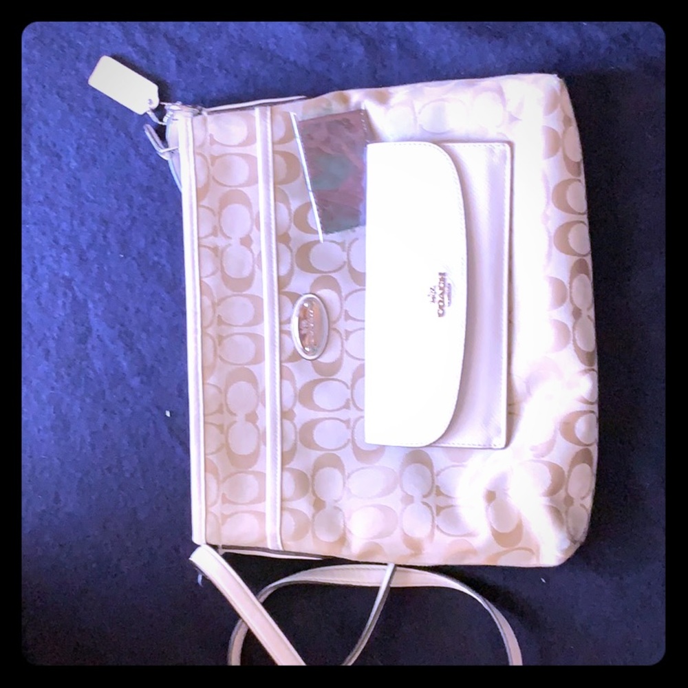 Cream colored Coach purse. Gently used.